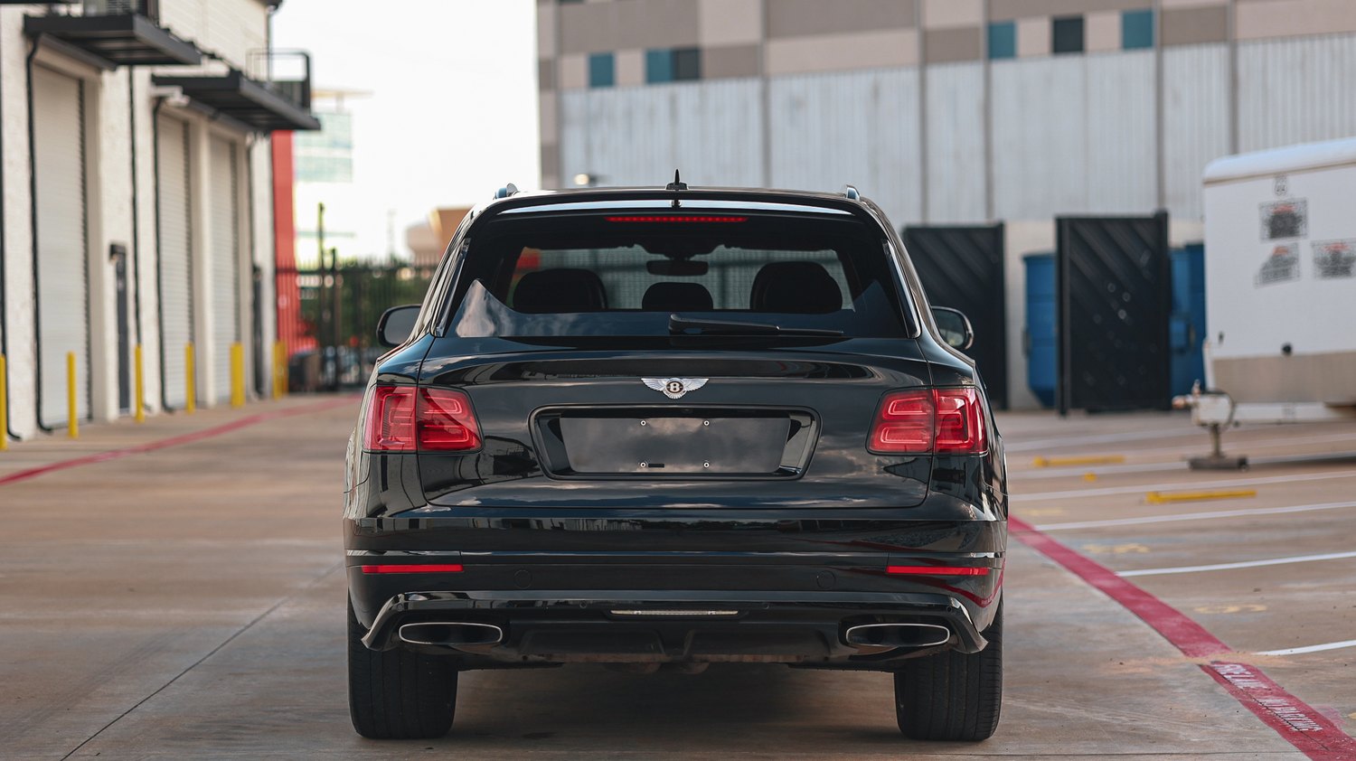 Rear view of a ceramic coated black Bentley Bentayga Speed