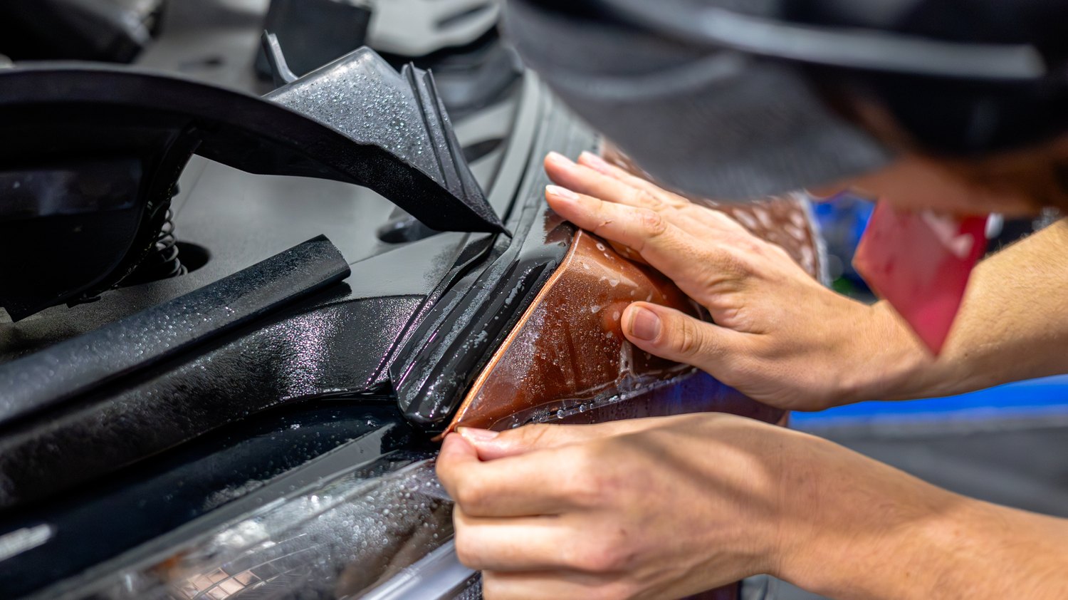 Tucking PPF over the top edge of the fender on a Lexus RX 350