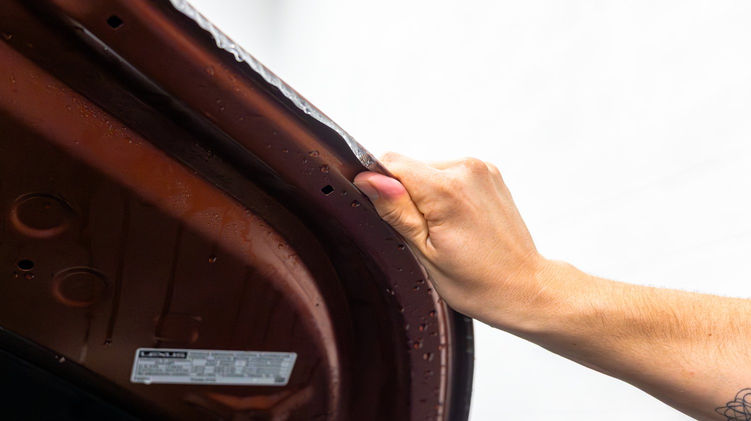 PPF wrapped around the underside of the hood on a copper Lexus RX 350