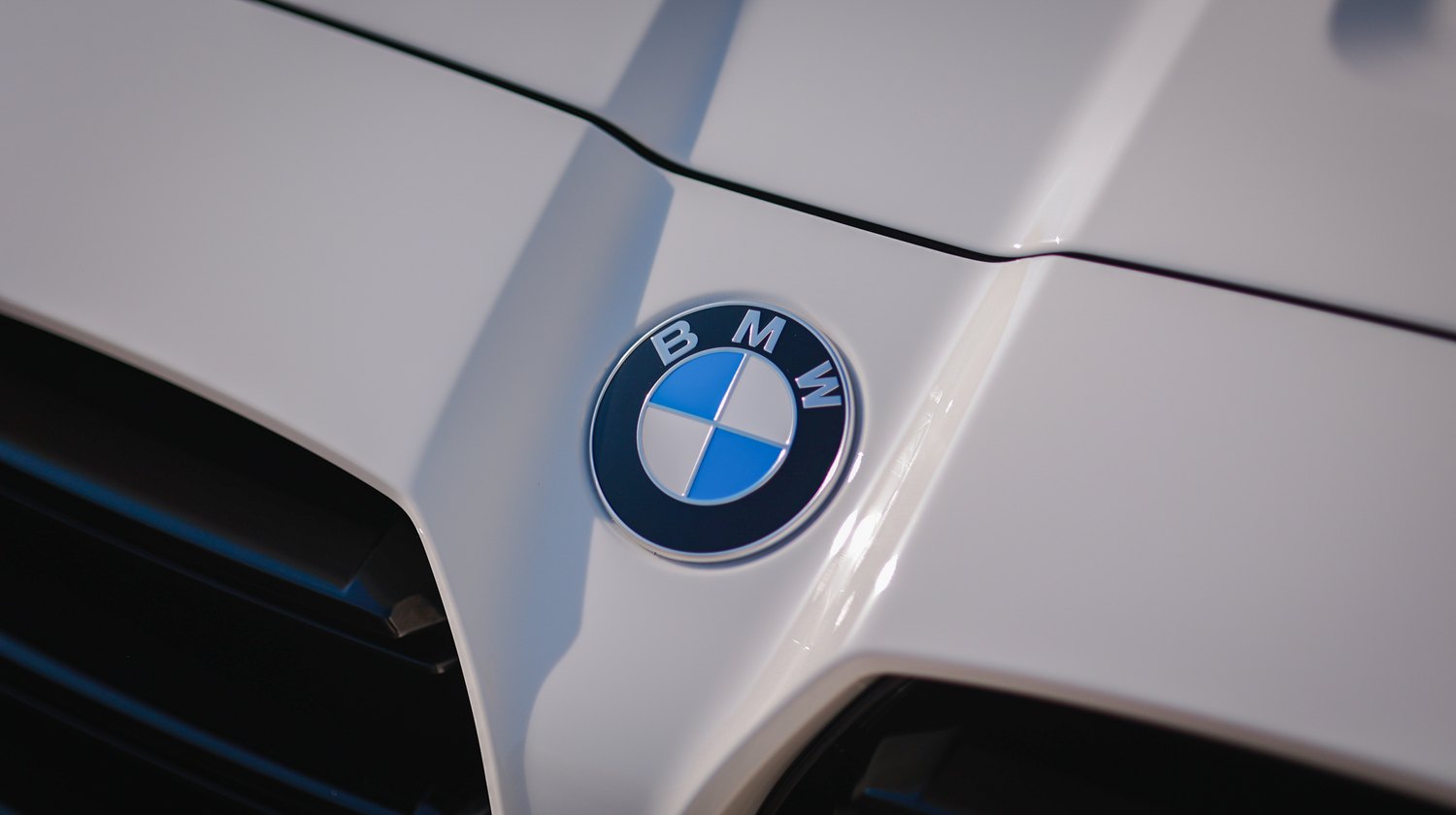 White 2025 BMW M3 G80 Competition — hood roundel detail