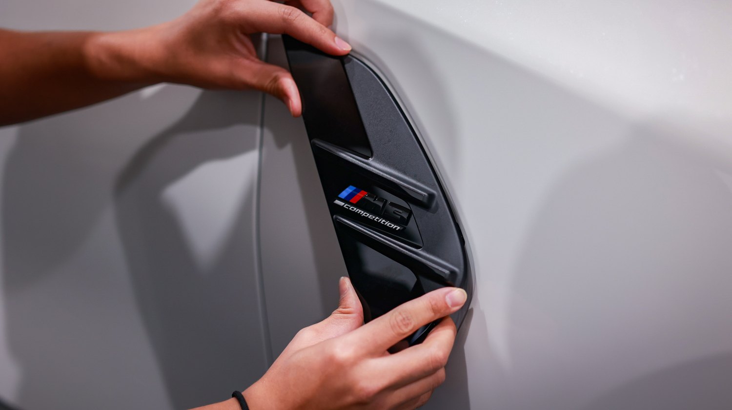 White 2025 BMW M3 G80 Competition — fender vent trim removal