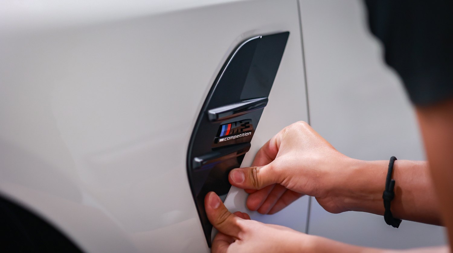 White 2025 BMW M3 G80 Competition — reinstalling fender vent