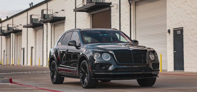 Black Bentley Bentayga Speed ceramic coating, paint correction — front three quarter wide at Humble Crew Auto Spa, Plano TX