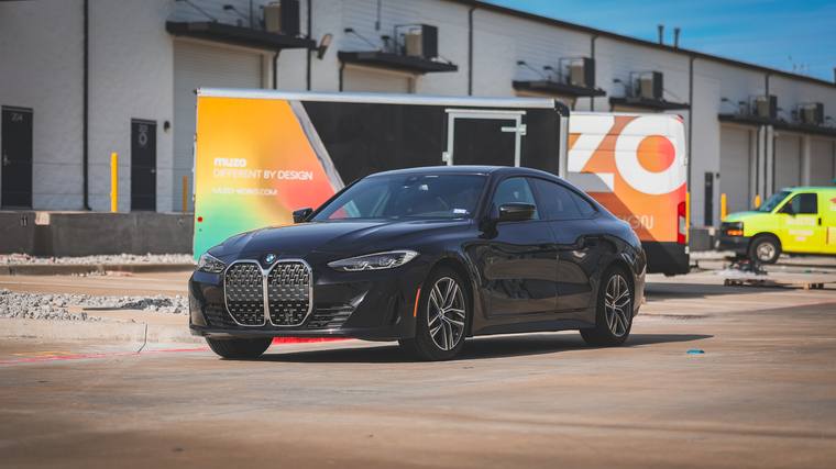 Black BMW 4 Series Gran Coupe 430i paint protection film, ceramic coating — front three quarter wide at Humble Crew Auto Spa, Plano TX