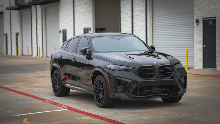 Black BMW X6 M Competition paint protection film, ceramic coating — front three quarter at Humble Crew Auto Spa, Plano TX