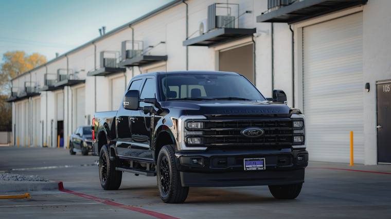 Black Ford F-250 Super Duty Lariat FX4 paint protection film, ceramic coating — front three quarter at Humble Crew Auto Spa, Plano TX