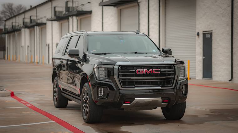 Black GMC Yukon XL AT4 paint protection film, ceramic coating — front three quarter at Humble Crew Auto Spa, Plano TX