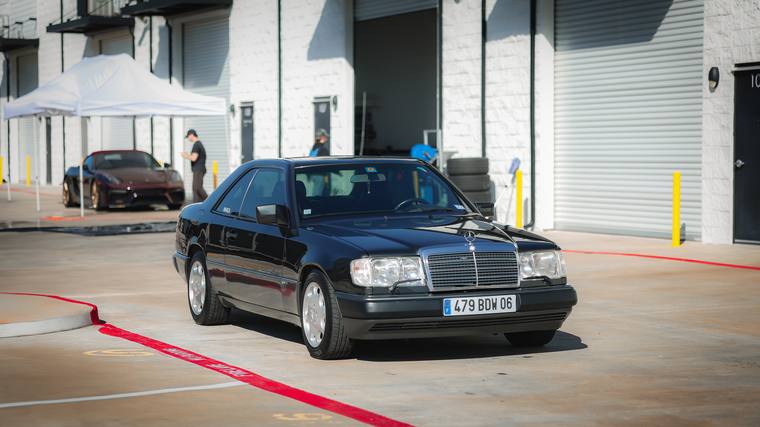 Black Mercedes-Benz 300 CE-24 W124 ceramic coating — front three quarter at Humble Crew Auto Spa, Plano TX