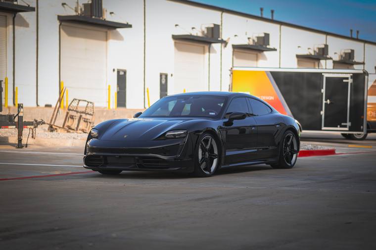 Black Porsche Taycan Turbo S paint protection film, ceramic coating — front three quarter at Humble Crew Auto Spa, Plano TX