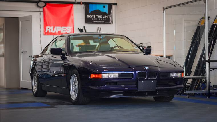 Blue BMW 8 Series E31 850i ceramic coating — front three quarter in shop at Humble Crew Auto Spa, Plano TX