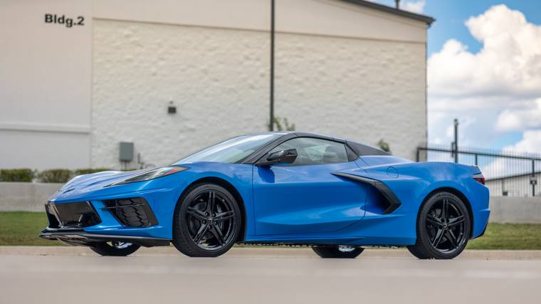 Blue Chevrolet Corvette C8 Stingray Convertible ceramic coating — bronze package front three quarter low at Humble Crew Auto Spa, Plano TX