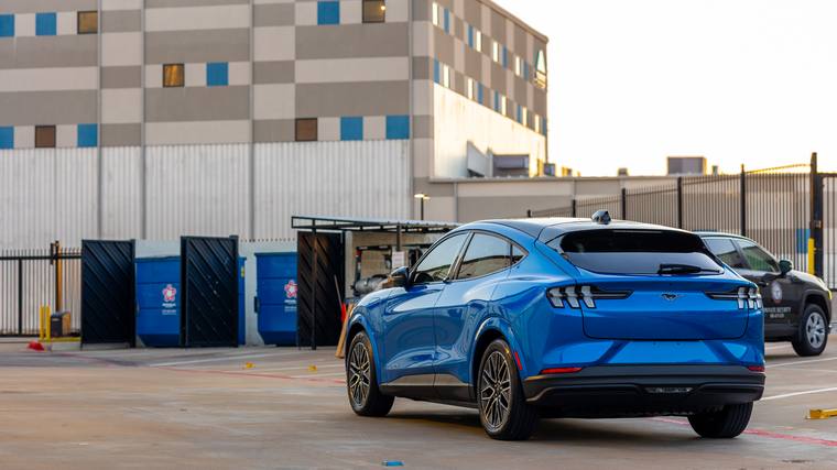 Blue Ford Mustang Mach-E paint protection film, ceramic coating — rear three quarter wide at Humble Crew Auto Spa, Plano TX