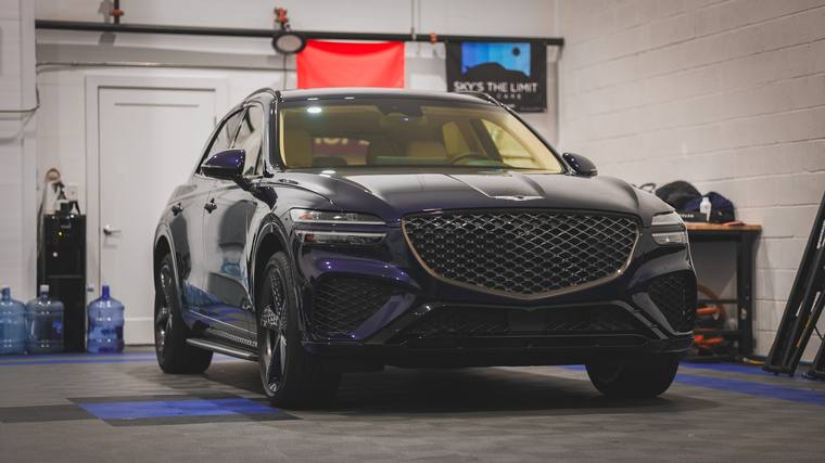 Blue Genesis GV70 paint protection film, ceramic coating — front three quarter in shop at Humble Crew Auto Spa, Plano TX