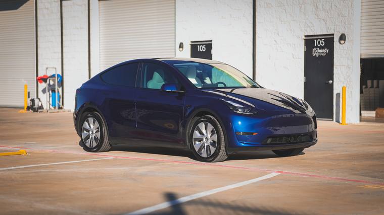 Blue Tesla Model Y paint protection film, ceramic coating — front three quarter at Humble Crew Auto Spa, Plano TX