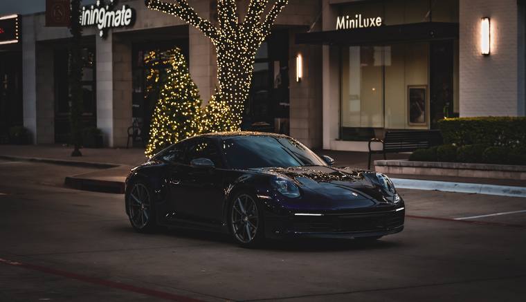 Chroma Blue Porsche 911 992 Carrera T color change PPF — legacy north front three quarter night at Humble Crew Auto Spa, Plano TX