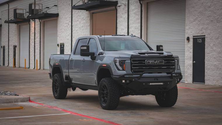 Gray GMC Sierra 2500HD AT4X AEV paint protection film, ceramic coating — front three quarter at Humble Crew Auto Spa, Plano TX