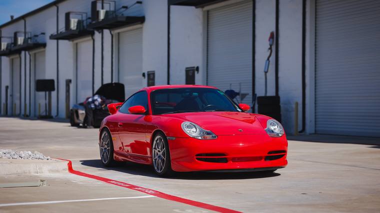 Guards Red Porsche 911 996 Carrera ceramic coating — front three quarter at Humble Crew Auto Spa, Plano TX