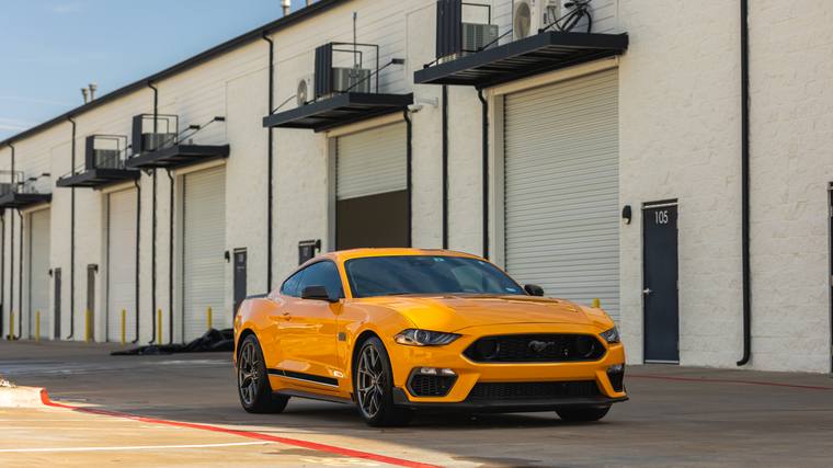 Orange Ford Mustang Mach 1 ceramic coating, paint correction — front three quarter at Humble Crew Auto Spa, Plano TX
