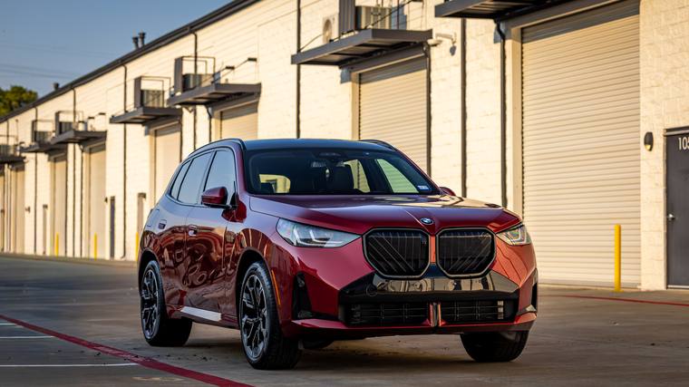 Red BMW X3 paint protection film, ceramic coating — front three quarter at Humble Crew Auto Spa, Plano TX