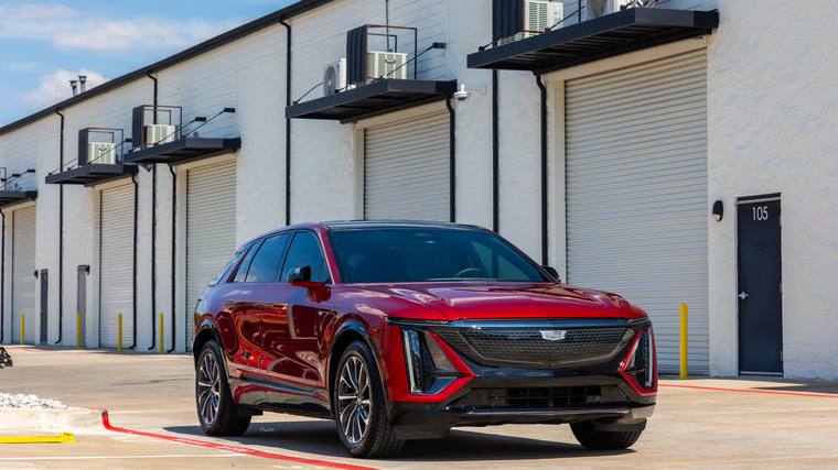 Red Cadillac Lyriq Sport ceramic coating — front three quarter at Humble Crew Auto Spa, Plano TX