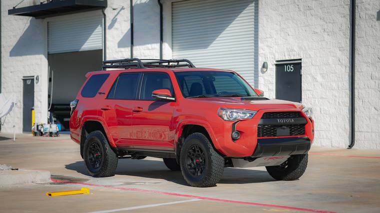 Red Toyota 4Runner TRD Pro paint protection film, ceramic coating — front three quarter at Humble Crew Auto Spa, Plano TX