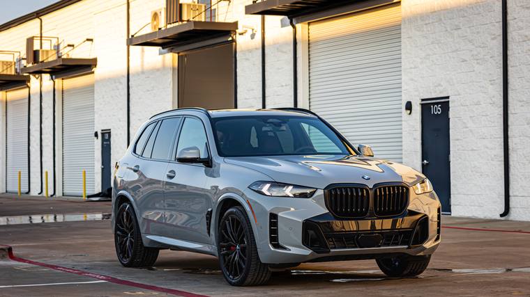 White BMW X5 M60i paint protection film, ceramic coating — front three quarter at Humble Crew Auto Spa, Plano TX