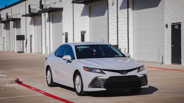 White Toyota Camry LE Hybrid paint protection film, ceramic coating — front three quarter at Humble Crew Auto Spa, Plano TX