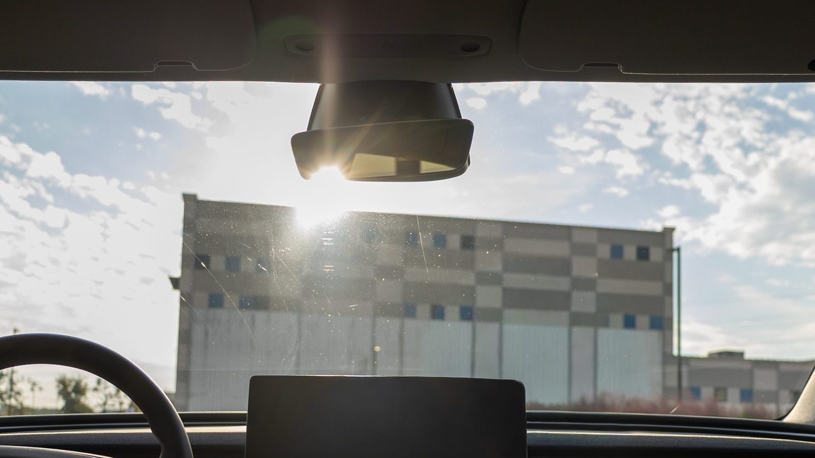 The view out of a windshield through ceramic tint on a bright day